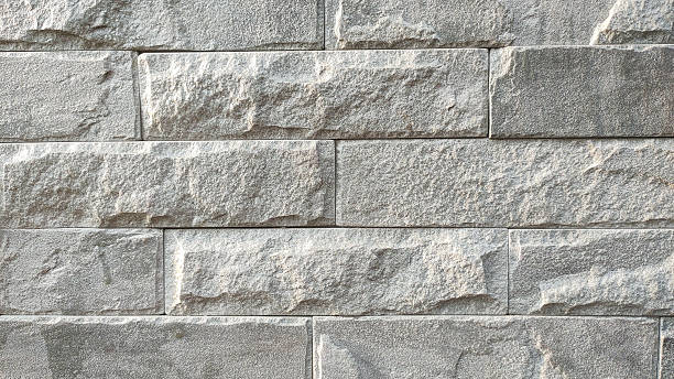 istock A gray brick wall with a gray stone border 2219956010