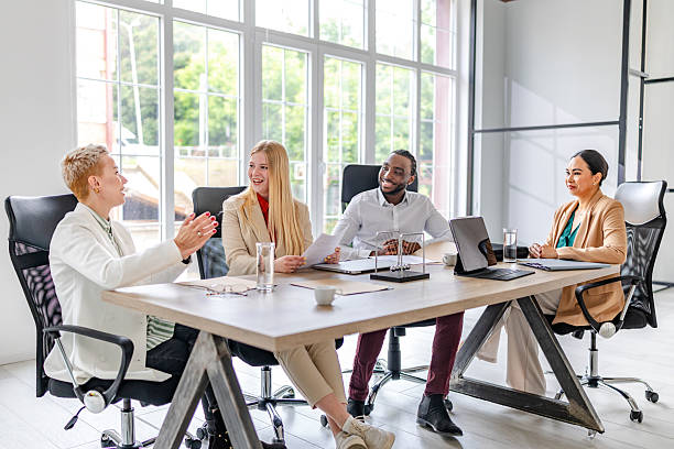 istock Professional adults engage in collaborative meeting in modern office environment 2219956133