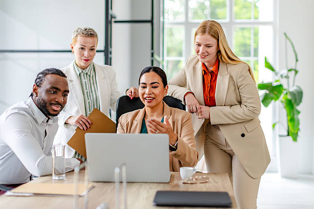 istock Team collaboration in a modern industrial office setting among young professionals working on a business project 2219956947