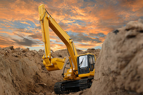 istock Excavator with Bucket  are digging canalize the soil in the construction site. 2219957114