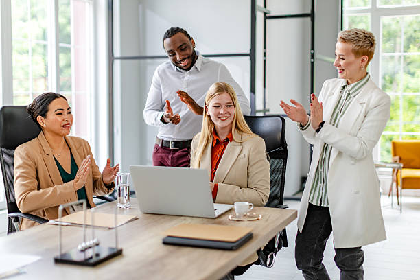 istock Team collaboration in a modern office setting during a productive meeting celebrating success 2219957150
