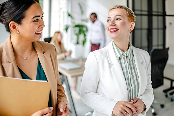 istock Engaged professionals collaborate in a modern industrial office setting during a mid-morning meeting 2219960040