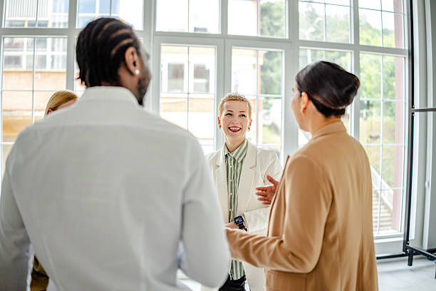 istock Engaged professionals discussing ideas in a modern industrial office environment during a collaborative meeting 2219960167