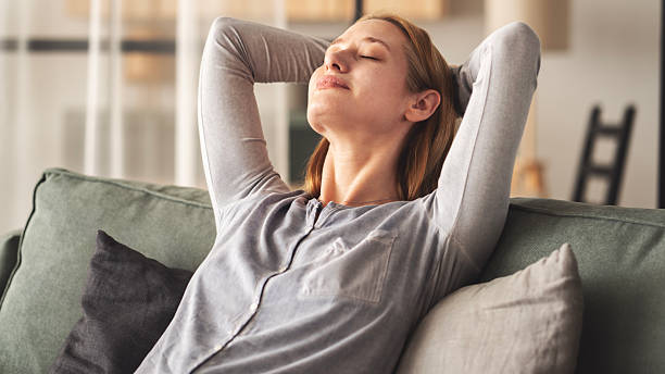 istock Young woman feels peaceful at home 2219960632