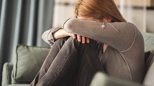 istock Sad young woman dealing with loss and psychological trauma 2219960703