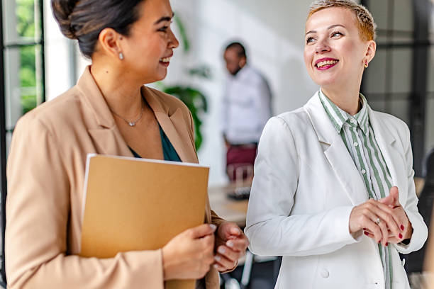 istock Engaging conversation between colleagues in a modern industrial office environment 2219960884