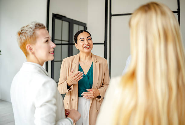 istock Engaging dialogue among business professionals in a modern office setting with a focus on collaboration and teamwork 2219960932