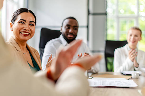 istock Engaging discussion among business professionals in a modern office setting during a collaborative meeting 2219961095