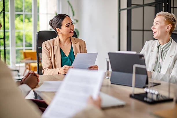 istock Engaging discussion among business professionals in a modern office setting during a collaborative meeting 2219961127