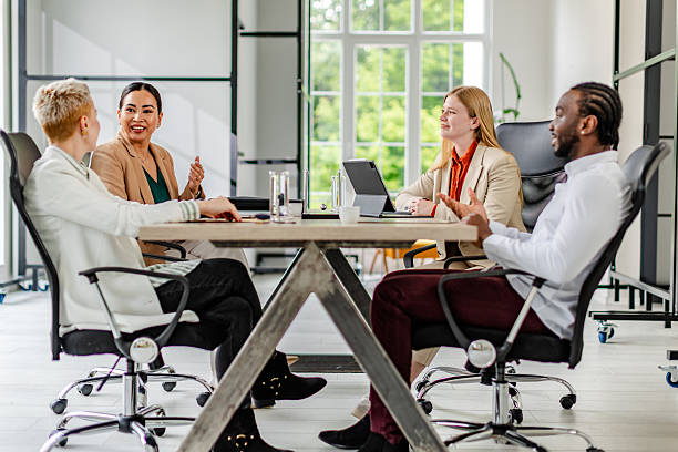istock Engaging discussion in a modern industrial office with diverse business professionals collaborating 2219961691