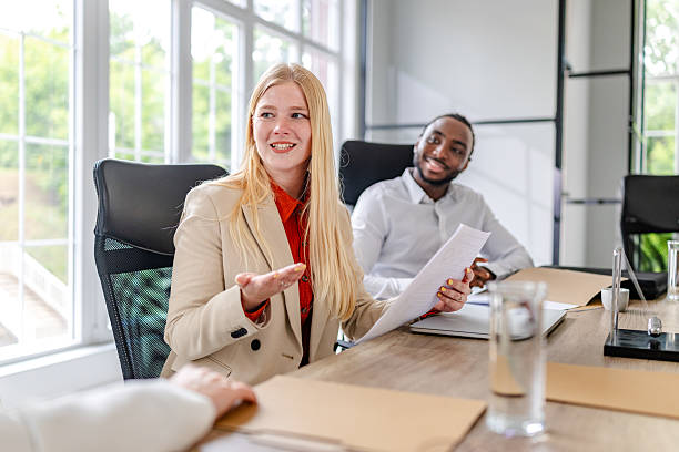 istock Engaging meeting in a modern industrial office with diverse professionals discussing ideas and solutions 2219961965