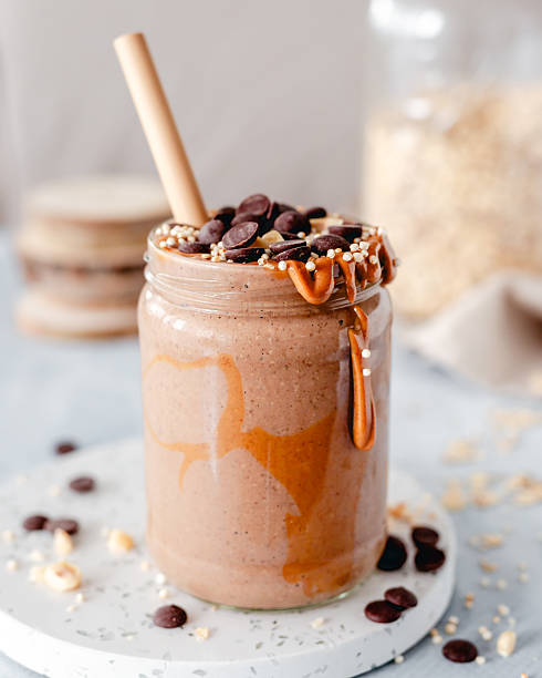 A jar of thick oat cacao breakfast smoothie with peanut butter