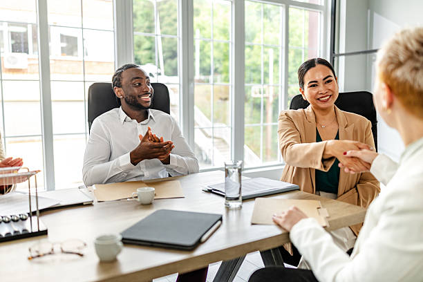 istock Business professionals engage in a productive meeting in a modern industrial office setting 2219963385