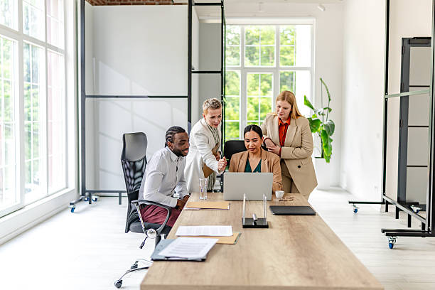 istock Collaboration among young professionals in a modern industrial office setting during a working meeting 2219965567