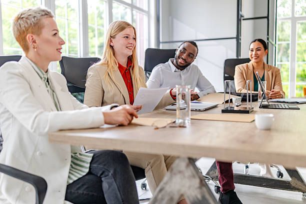 istock Collaborative meeting among diverse professionals in a modern industrial office space 2219965974