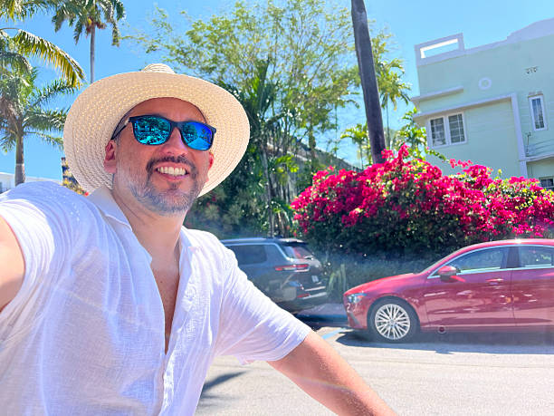 istock Tourist riding a bicycle and taking a selfie in Miami Beach 2219967662