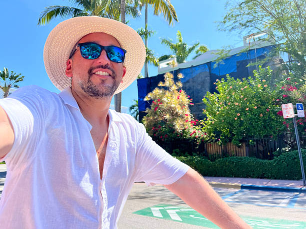 istock Tourist riding a bicycle and taking a selfie in Miami Beach 2219967712