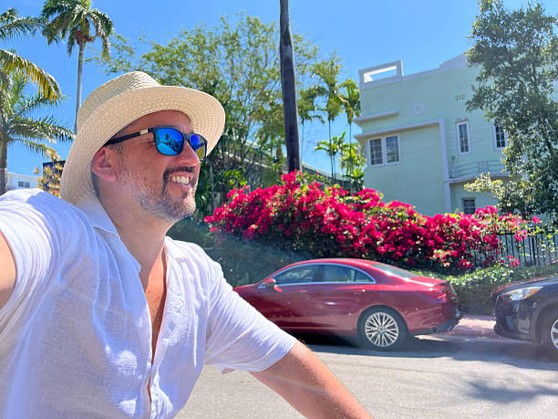 istock Tourist riding a bicycle and taking a selfie in Miami Beach 2219967732