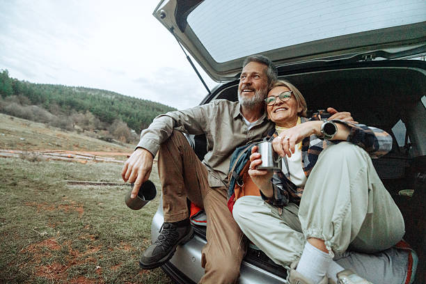 istock Active mature couple having a warm drink after hike in nature 2219968663