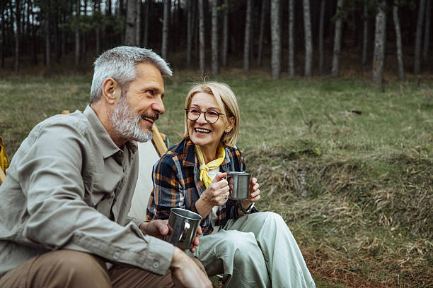 istock Mature couple enjoying coffee while camping in nature together 2219968852