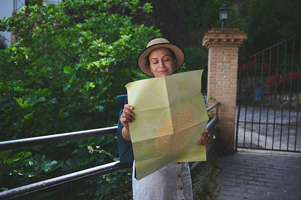 istock Woman Navigating a Scenic Path with a Map on a Historical Adventure 2219969260