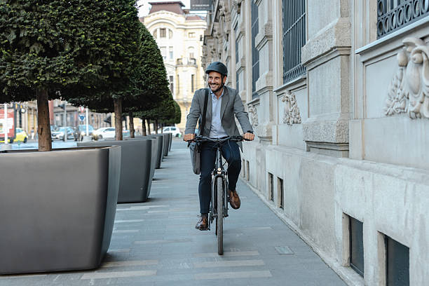 istock Professional commuting through city on bicycle wearing helmet for environmental awareness 2219974803
