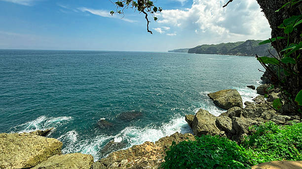 istock Rocky Coastal View with Cliffs and Ocean Horizon 2219977432