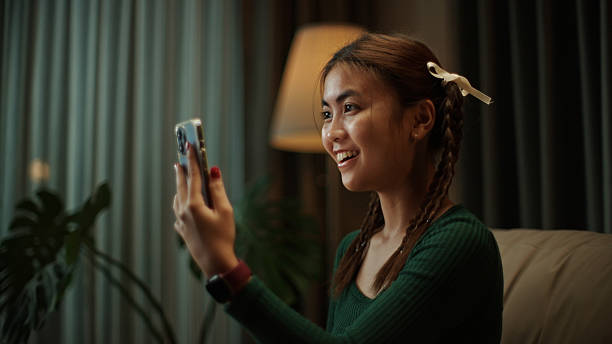 istock Teenager making a video call on smartphone at night. 2219977596