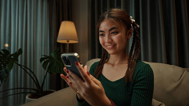 istock Teenager making a video call on smartphone at night. 2219977894