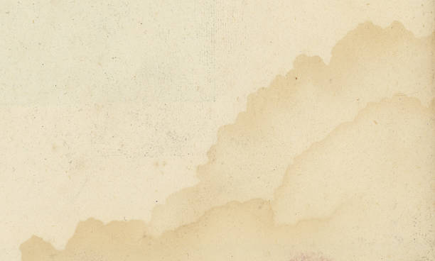 Close up of antique paper texture with water stains.