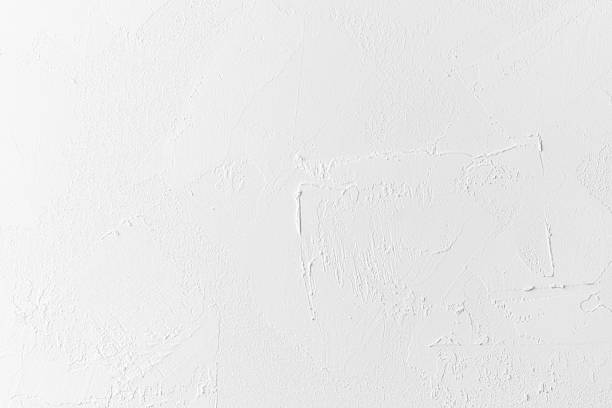 istock Textured white wall with subtle patterns and fine details in natural light 2219981080