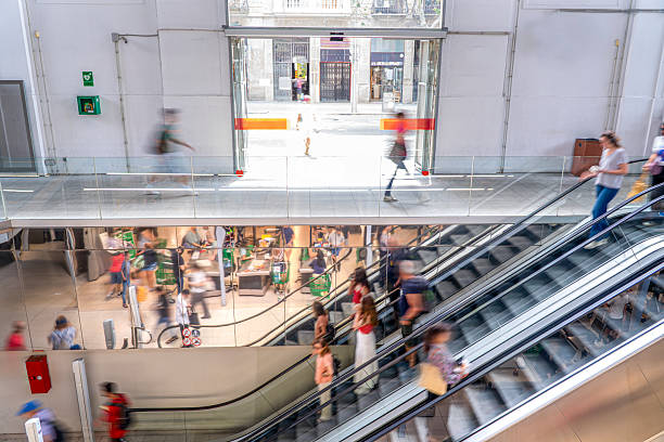 crowed people in blurred motion on Escalator.