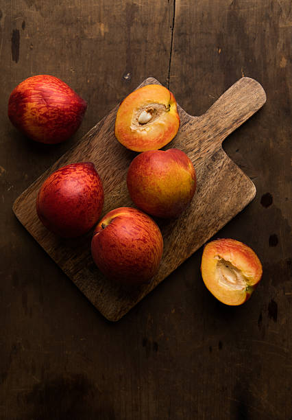 istock Fresh peaches on wooden table 2219988180
