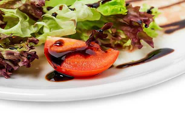 Tomato and lettuce closeup with soya sauce. As a whole background.