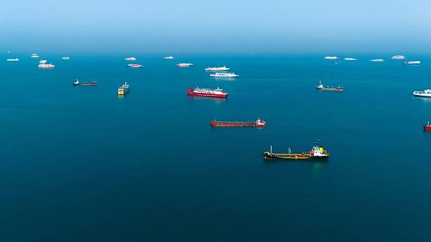 istock Aerial view of cargo ships in calm blue waters. 2219989271