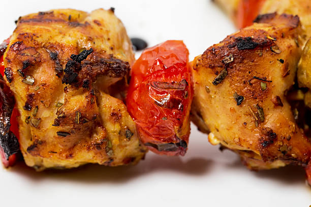 Delicious shish kebab on skewers closeup. As a whole background.