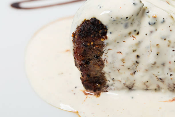 Steak with white mushroom sauce. As a whole background.