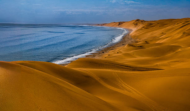 View of coastline under overcast sky