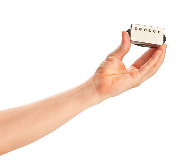istock humbucker pickup in hand 2219994540