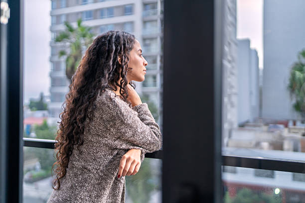 istock Digital nomad enjoying city view from airbnb balcony 2219994841