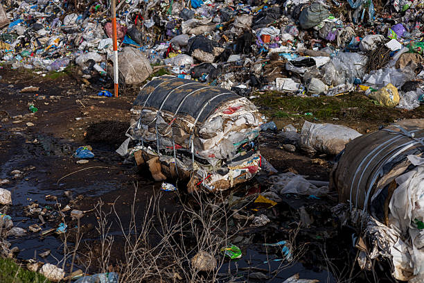istock Plastic waste and other debris accumulate at a landfill site, posing significant challenges to environmental management and recycling efforts 2219998511