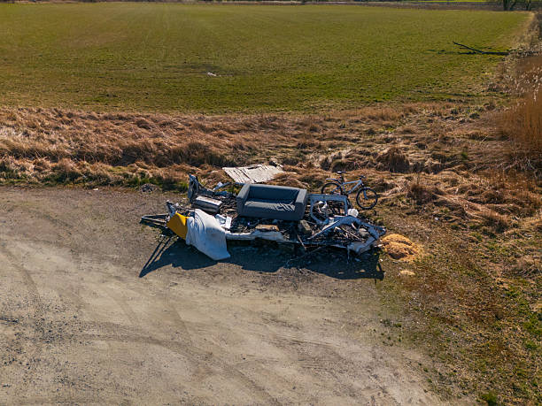 istock Abandoned destroyed vehicle with debris in empty field.. 2219999249