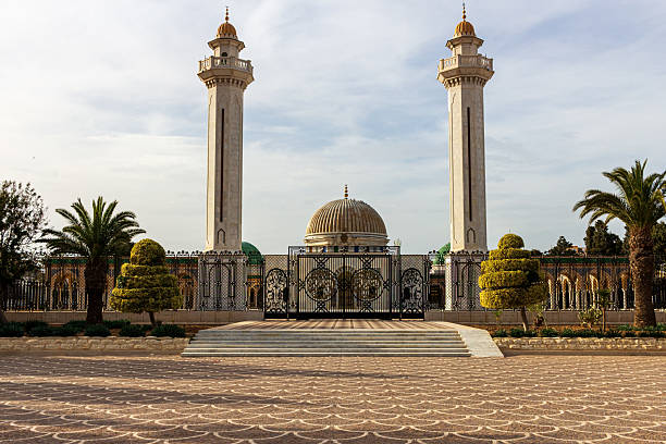 istock A mosque with tall minarets and a central dome stands against a cloudy sky 2220000009