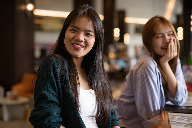 istock Two young woman together in cafe restaurant 2220000096