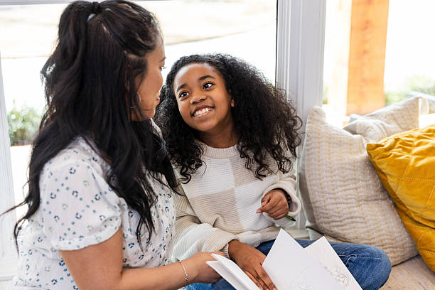 istock Happy Mother and Daughter Bonding While Reading Together 2220000650