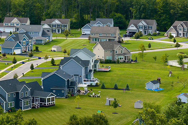 istock American dream homes as example of real estate development in US suburbs. View from above of residential houses in living area in Rochester, NY 2220002309