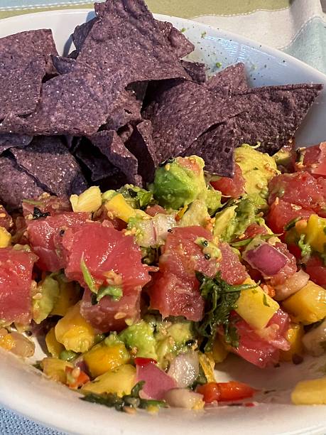 istock Colorful Ahi Tuna Poke with Mango, Avocado, and Blue Corn Chips 2220003389