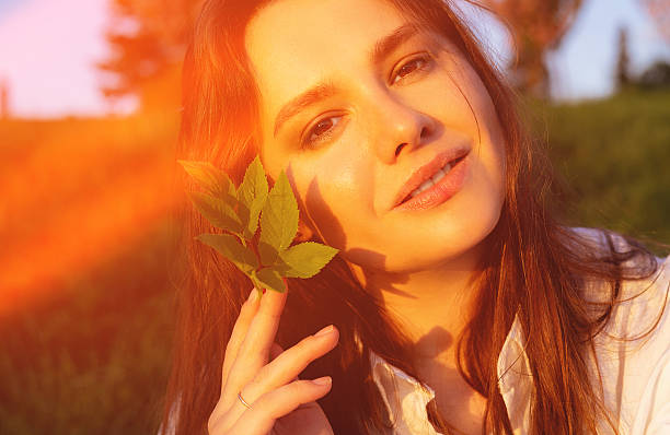 Beautiful young woman loves nature