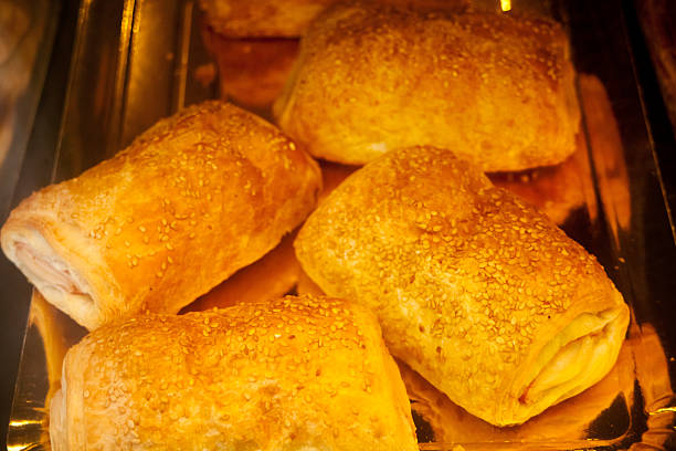 Heap of spanish napolitanas stuffed with custard cream , spanish traditional. Close-up  view.