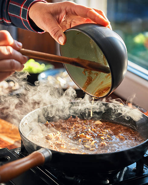 istock Preparing Bibimbap Korean Rice Dish in Domestic Kitchen 2220004148